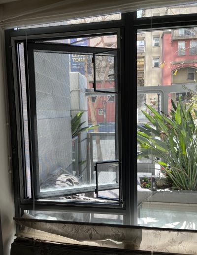 Standoff Screen Frame with Custom Wickets installed for Casement Window Handle Access