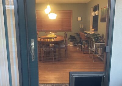 Standard Sliding Screen Door with Large Pet Door Installed (in Bronze)