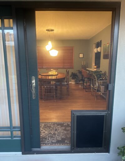 Standard Sliding Screen Door with Large Pet Door Installed (in Bronze)