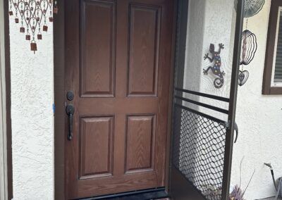 Protecto Swinging Screen Door (in Bronze) Hinged Open